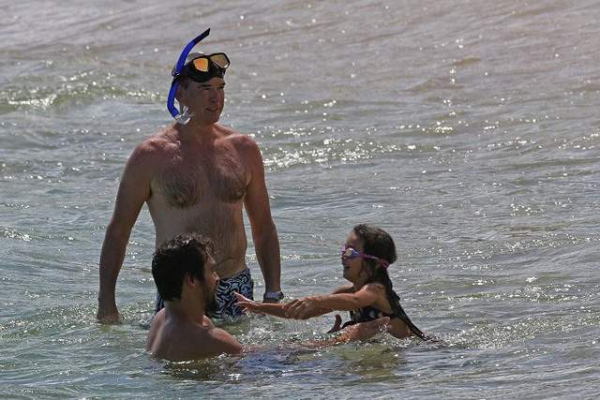 EXCLUSIVE  Pierce Brosnan and Jason Momoa go shirtless on the beach in Hawaii