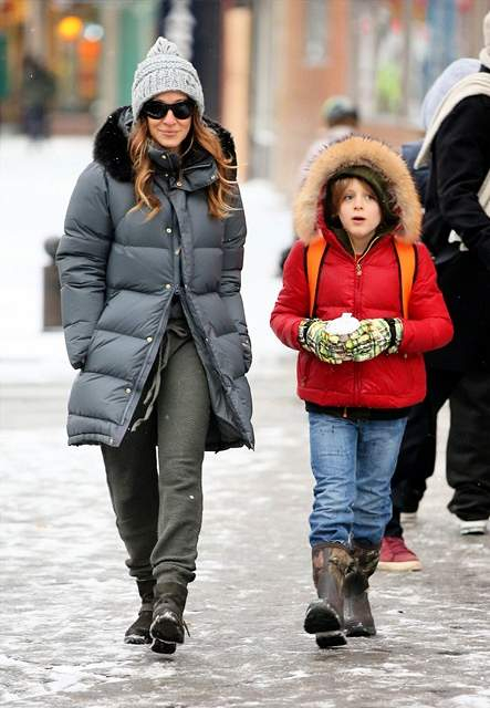 Actress Sarah Jessica Parker walks her twin daughters Tabitha and Marion on a snowy day in West Village in New York City