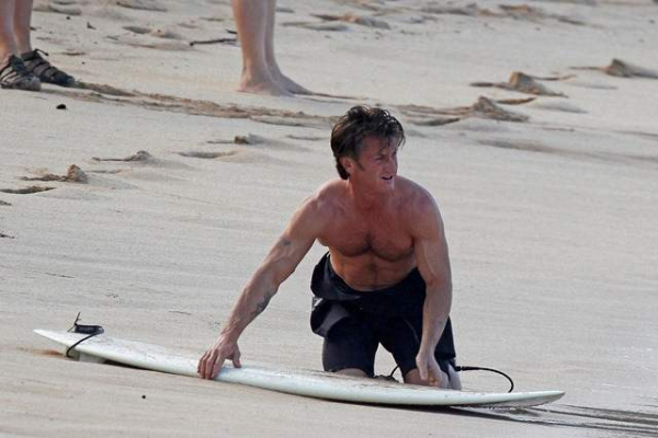 EXCLUSIVE  A shirtless and ripped Sean Penn goes surfing in Hawaii