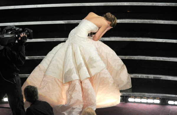 Actress Jennifer Lawrence stumbles as she walks on stage to accept the award for best actress in a leading role for   Silver Linings Playbook   during the Oscars at the Dolby Theatre on Sunday Feb  24  2013  in Los Angeles    Photo by Chris Pizzello Invis