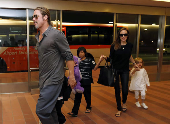 September 20, 2016 - Tokyo, Japan - Hollywood actors Brad Pitt (L) and actress Angelina Jolie (2nd R) arrive with their children Knox (beside Pitt), Vivienne (R) and Pax (C) at Haneda international airport in Tokyo, Japan on July 28, 2013 (Credit Image: © Issei Kato/Reuters via ZUMA Press)