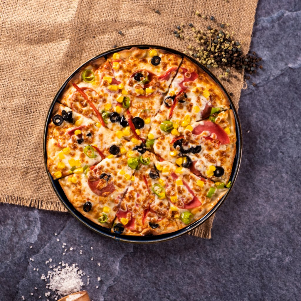Πίτσα με ρύζι στον φούρνο: Μία συνταγή γεμάτη εκπλήξεις 