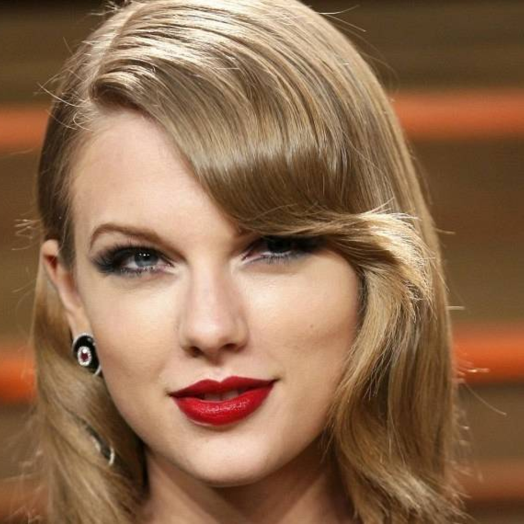 442326-musician-taylor-swift-arrives-at-the-2014-vanity-fair-oscars-party-in-.jpg