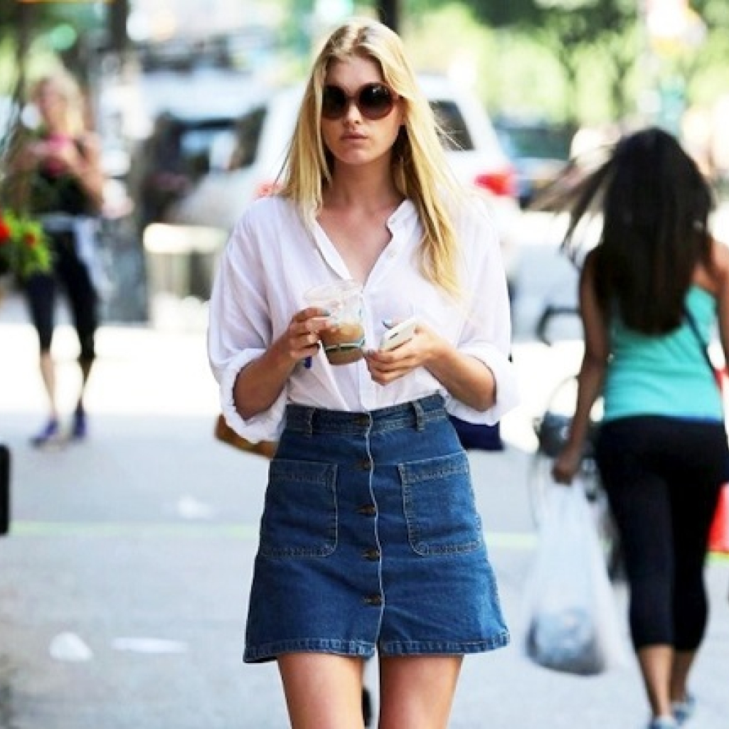 Le-Fashion-Blog-Model-Off-Duty-Street-Style-Elsa-Hosk-70s-Inspired-Button-Front-Denim-Skirt-Oversized-Round-Sunglasses-White-Shirt-Braid-Sandals.jpg