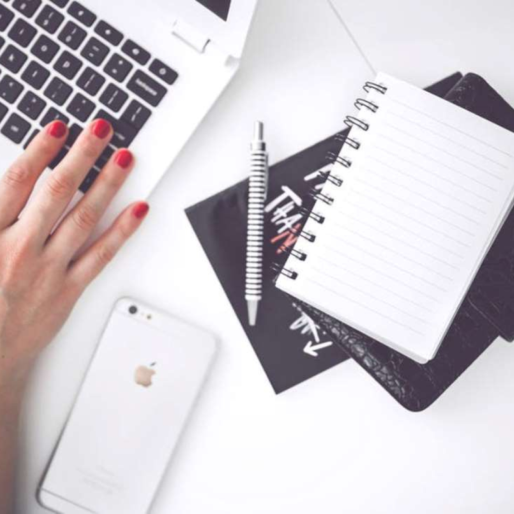woman-hand-smartphone-desk.jpg