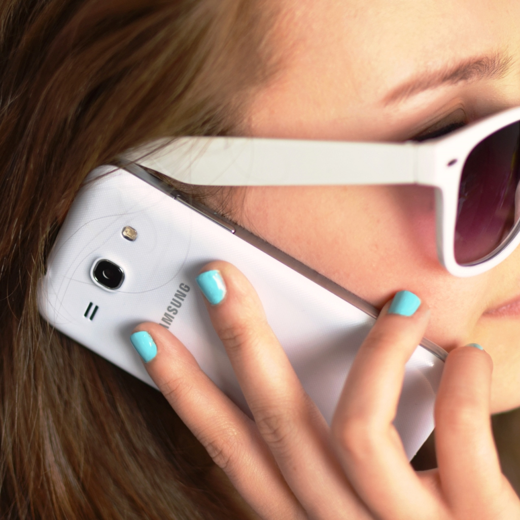 person-sunglasses-woman-smartphone.jpg