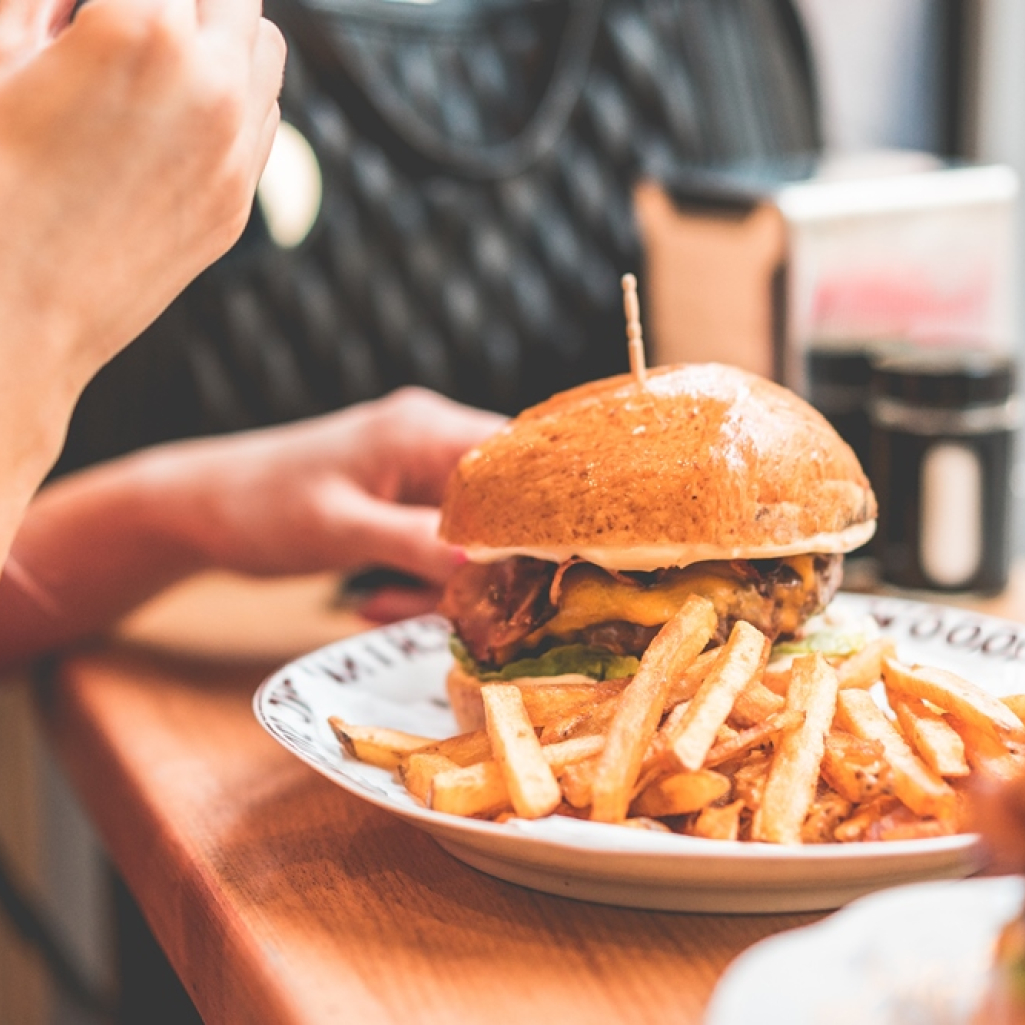 woman-preparing-to-eat-big-bacon-burger-picjumbo-com.jpg