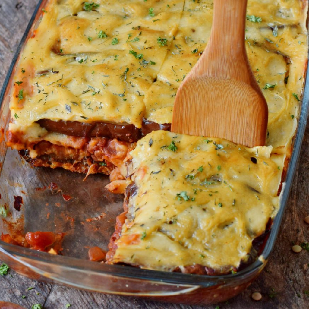 vegan-moussaka-and-wooden-spatula-in-a-glass-baking-dish.jpg