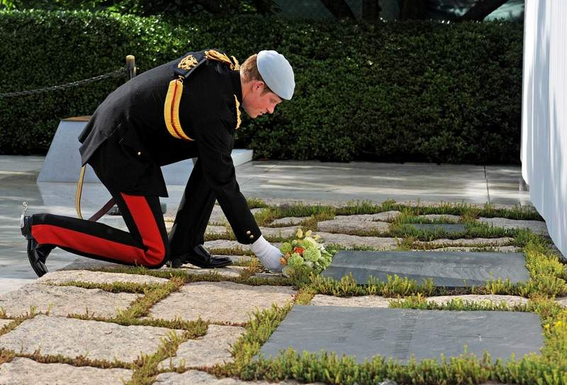 Prince Harry lays a wreath at the JFK Memorial