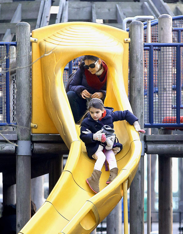 EXCLUSIVE  Suri Cruise goes down a slide while mom Katie Holmes watches on during a play date in NYC