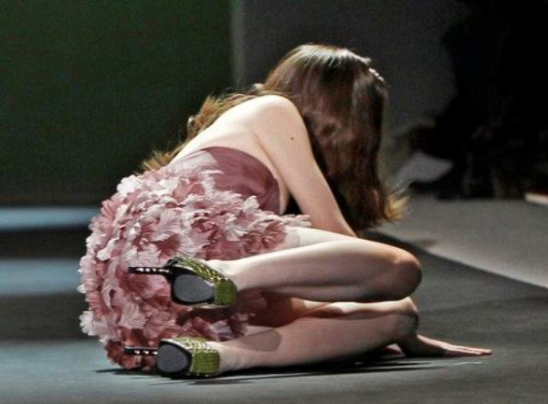 FILE - In this Feb  10  2011 file photo  a model falls to the runway during the Christian Siriano Fall 2011 show during Fashion Week in New York   AP Photo File 