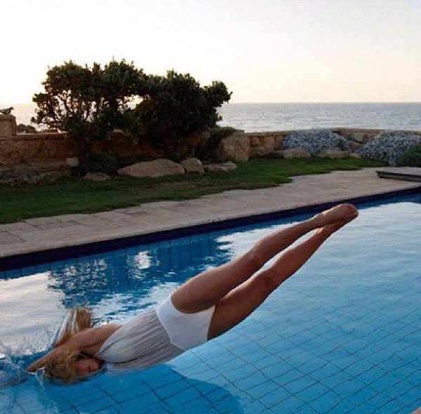 Bar Refaeli dives into a pool