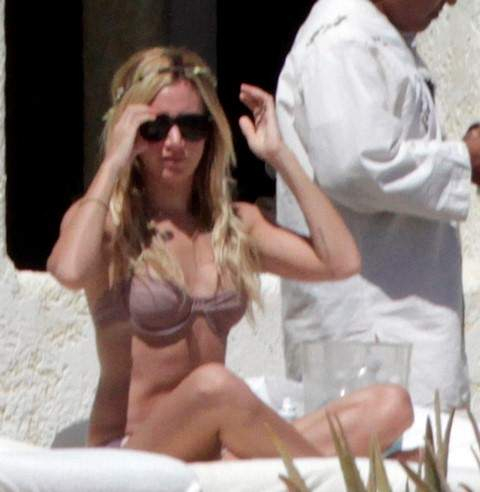 Ashley Tisdale seen sunbathing in Mexico with Christopher French at an exclusive resort