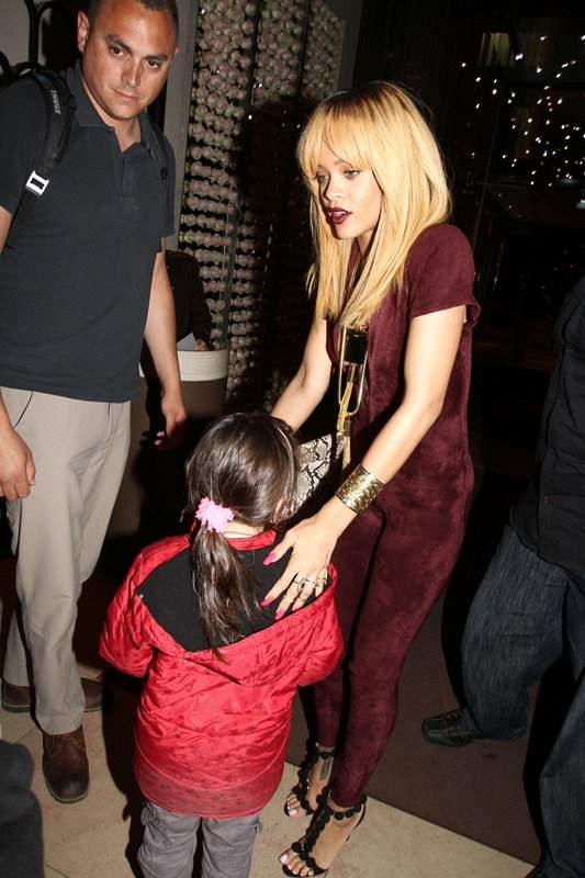 Rihanna meets a young fan on the way to his hotel nParis France on june 5 2013