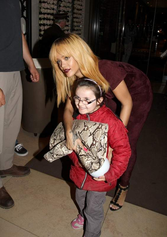 Rihanna meets a young fan on the way to his hotel nParis France on june 5 2013