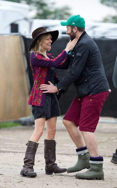 Sienna Miller and Chris O Dowd greet each other at Glastonbury festival Somerset