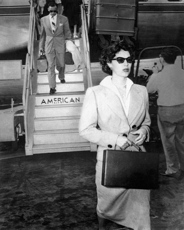 FRANK SINATRA trails AVA GARDNER off airplane in El Paso en route to Mexico City 8 3 51