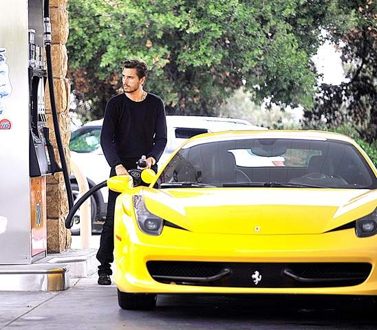 EXCLUSIVE  Scott Disick pumps some fuel into his cool yellow ferrari in Calabasas  CA