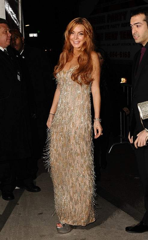 Lindsay Lohan arriving at amfAR New York Gala to kick off Fall 2013 Fashion Week at Cipriani Wall Street