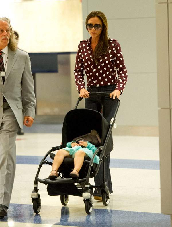 Victoria Beckham and daughter Harper arrive at JFK airport in NYC
