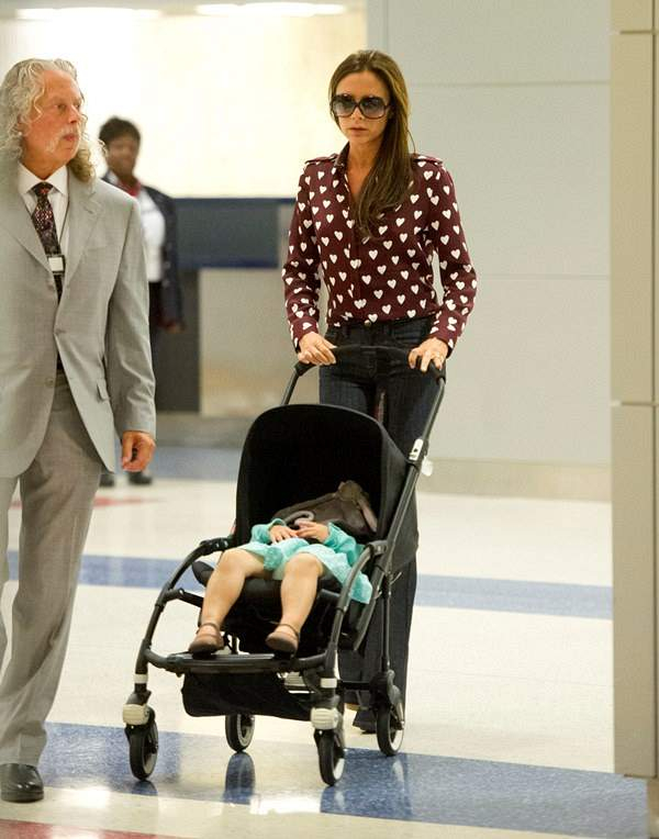 Victoria Beckham and daughter Harper arrive at JFK airport in NYC