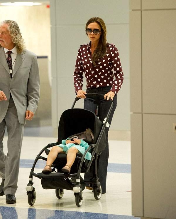 Victoria Beckham and daughter Harper arrive at JFK airport in NYC