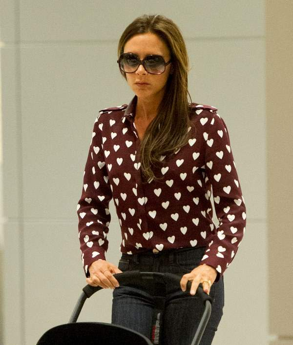 Victoria Beckham and daughter Harper arrive at JFK airport in NYC