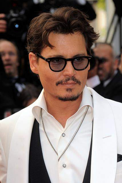 Johnny Depp and Penelope Cruz arrive at the Pirates of the Caribbean On Stranger Tides premiere as part of the 64th Cannes Film Festival in Cannes France r P rPictured Johnny Depp r P r B Ref SPL277807 140511 B BR rPicture by Fotostore 