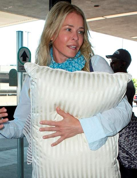 A make up free Chelsea Handler arrives at LAX with her pillow