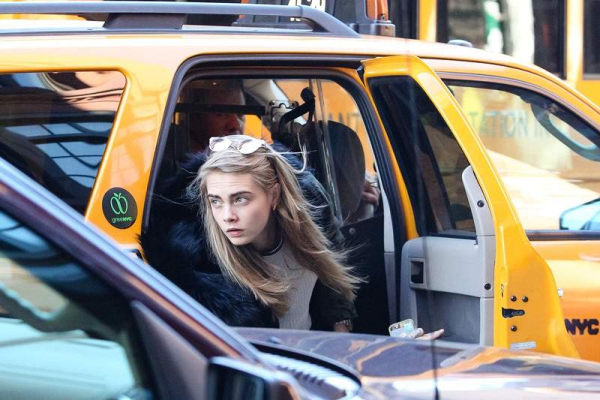 Cara Delevingne tries to stay incognito as she leaves her Downtown hotel in New York City r P rPictured Cara Delevingne r P B Ref SPL653417 181113 B BR rPicture by Allan Bregg Splash News BR r P P r B Splash News and Pictures B BR 