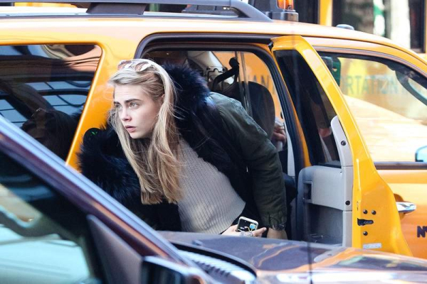 Cara Delevingne tries to stay incognito as she leaves her Downtown hotel in New York City r P rPictured Cara Delevingne r P B Ref SPL653417 181113 B BR rPicture by Allan Bregg Splash News BR r P P r B Splash News and Pictures B BR 