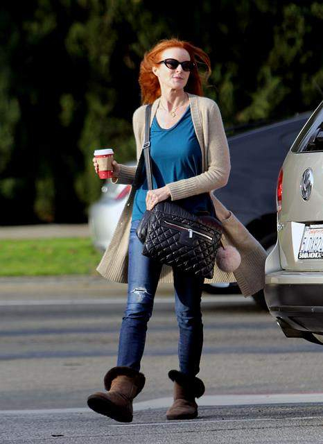 Marcia Cross grabs a coffee in Santa Monica wearing her warm winter boots CA