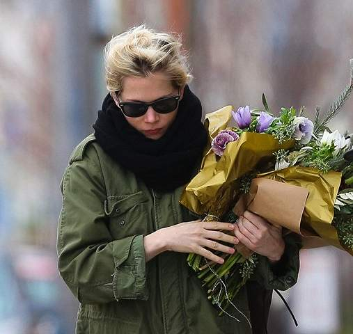 Michelle Williams walking with flowers in Brooklyn  New York
