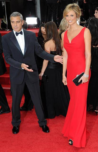 George Clooney is the perfect gentleman at the Golden Globes helping girlfriend Stacy Keibler down some stairs  LA
