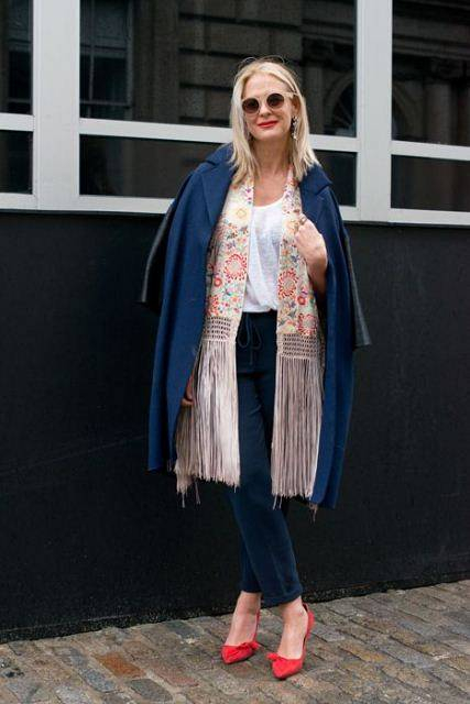 LONDON  ENGLAND - FEBRUARY 14  Stylist and Contributing Editor at Red Magazine Deborah Brett wears a Roksanda Ilincic coat  Talitha fringe jacket  Isabel Marant for H M t-shirt  Isabel Marrant  shoes  J  crew trousers and earrings  Asos sunglasses and a J