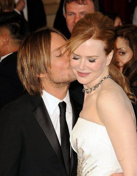 Keith-planted-peck-his-lady-cheek-Oscars-February