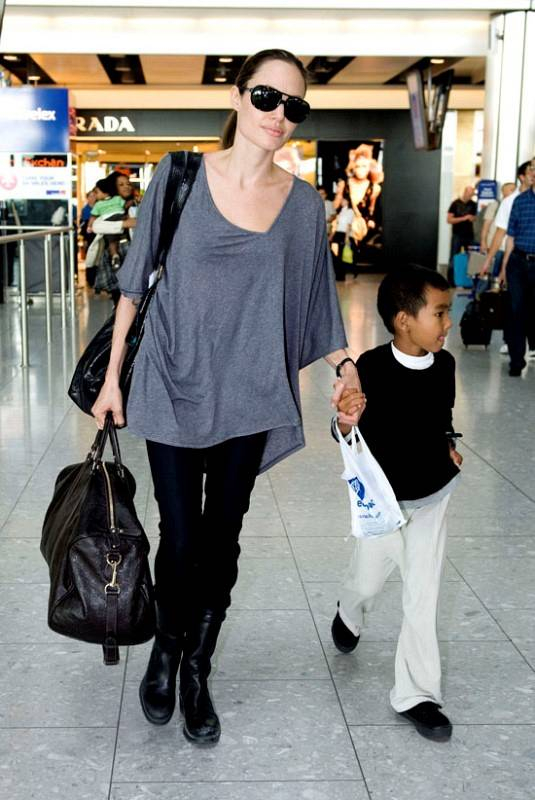 07-24-09 London UKAngelina Jolie and her seven year old son Maddox are pictured flying into Heathrow Airport The actress has been to Amman Jordan where she was honoured for her charity work by the Arab Children s Congress She also visited Baghdad NON