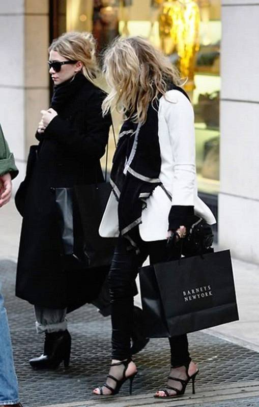 The Olsen Twins  Mary-Kate and Ashley  are seen leaving Barney  s after shopping for several hours  Tori Spelling was there shopping at the same time   Mary-Kate wore see-through net shoes  They were accompanied  as usual  by their burly bodyguard  n P  n