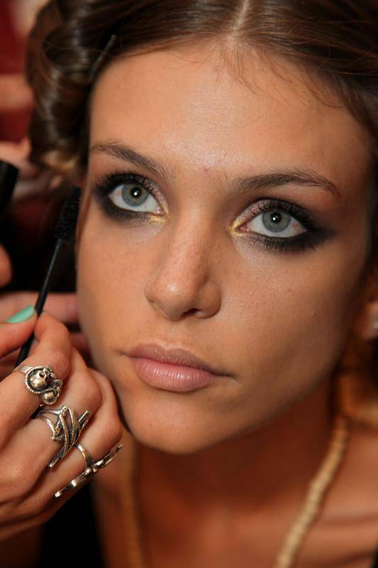 MIAMI  FL - JULY 21   A model prepares backstage with MAKE UP FOR EVER at the Mara Hoffman show during Mercedes-Benz Fashion Week Swim 2013 at The Raleigh on July 21  2012 in Miami  Florida    Photo by Donald Bowers Getty Images for MAKE UP FOR EVER 