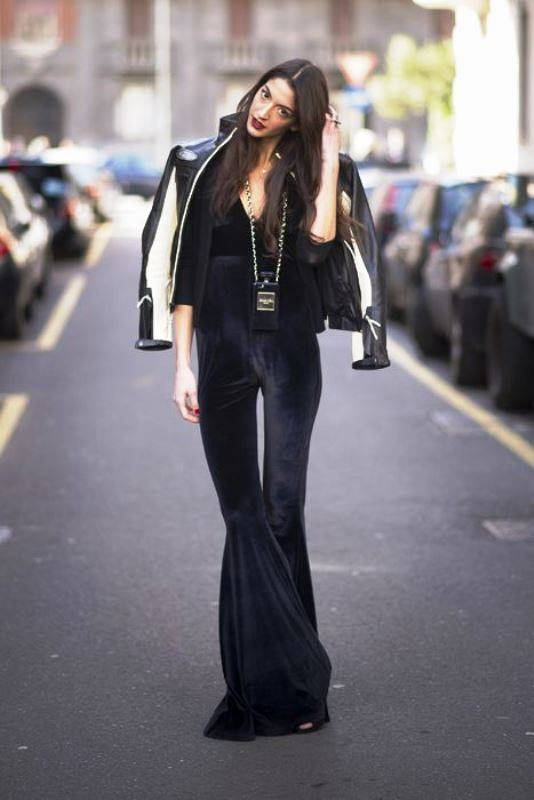 MILAN ITALY - FEBRUARY 23 Sarah Nicole Rosetto seen wearing a jumpsuit from Sarah Rosetto a jacket from Harley Davidson and a phonecover from Chanel outside the Dolce and Gabana show on February 23 2014 in Milan Italy Photo by Timur Emek Getty Ima