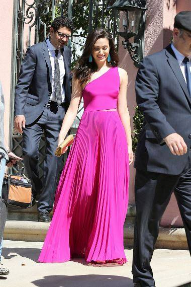 West Hollywood  CA - Emmy Rossum heads to the Critics   Choice Awards with her boyfriend close behind  The   Shameless   actress looked stunning in a full length pink gown as she walked to her waiting limo  n n nAKM-GSI      June  19  2014 n n nTo License