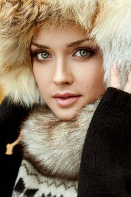 Portrait of a fresh and lovely woman wearing fur hat