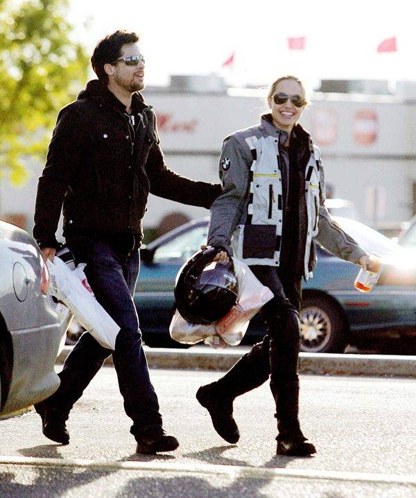 Brad Pitt and Angelina Jolie finally make their romance public as they head out on his and hers motorcycles in Edmonton  Canada