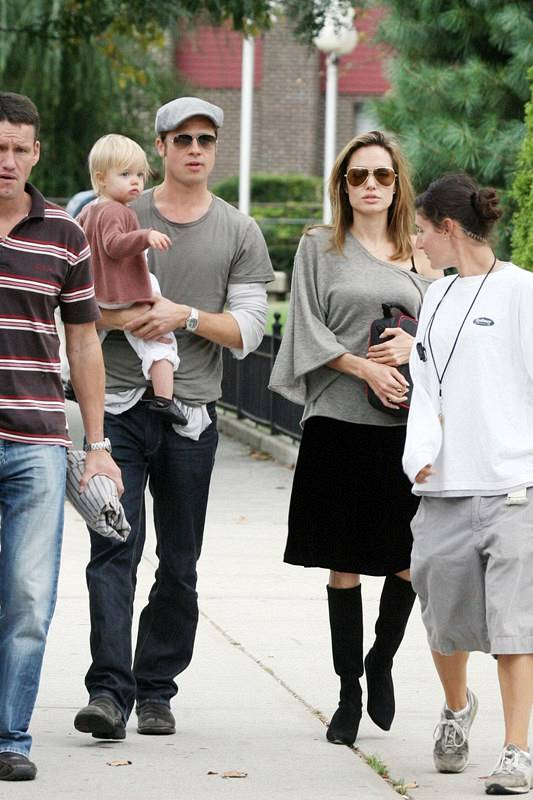 Mum and Dad Angelina Jolie and Brad Pitt walk with baby Shiloh in New York City  The happy couple strolled down the street on the way to Brad  s trailer while he is filming his new movie Burn After Reading  r P  r B Ref  SPL4329 011007   B  br  rPicture b