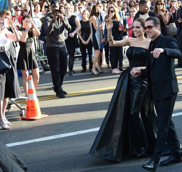 Angelina Jolie accompanied by fiance Brad Pitt greets the crowds as she arrives at the premiere of her new film   Malificent  