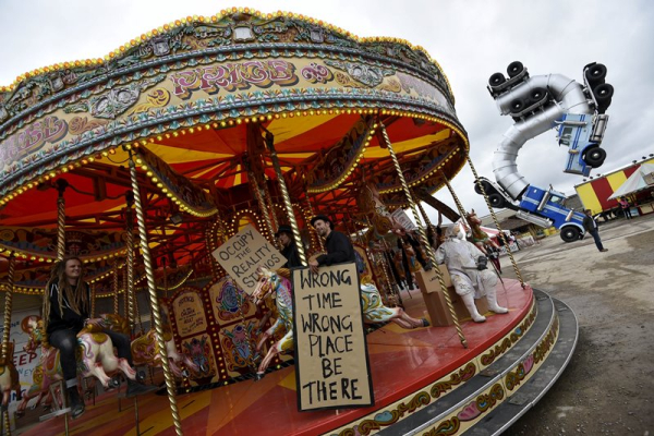 People ride a carousel at   Dismaland    a theme park-styled art installation by British artist Banksy  at Weston-Super-Mare in southwest England  Britain  August 20  2015  REUTERS Toby Melville
