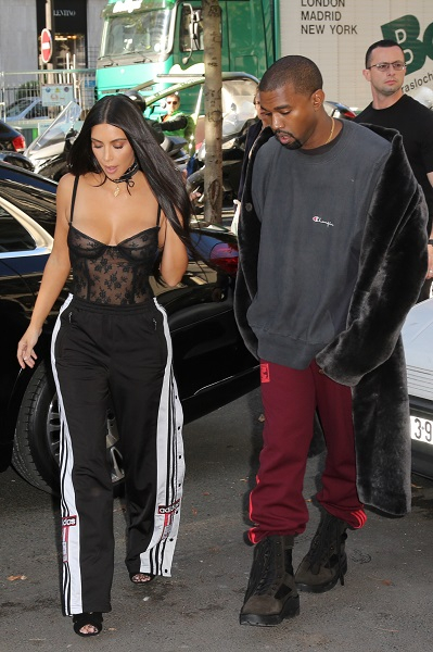 Kim and Kourtney Kardashian with Kanye West arriving at Givenchy - Paris