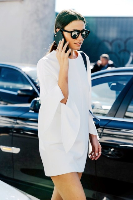 le-fashion-blog-mfw-street-style-low-ponytail-black-mirrored-sunglasses-minimal-rings-white-dress-with-tie-sleeves-via-vogue-paris