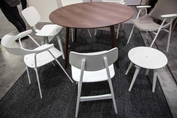 round-walnut-dining-table-with-white-chairs-c