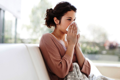 sick-women-blowing-nose-romantic-care-package.jpg